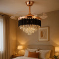 Retractable-blade crystal fan chandelier in a warm bedroom