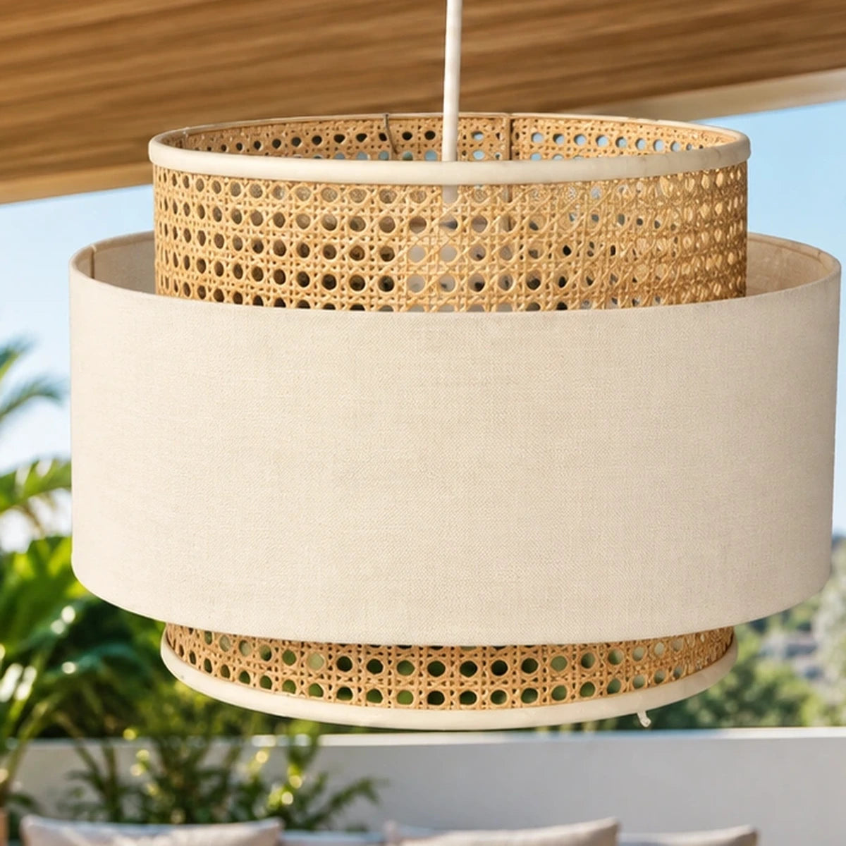 Close-up of layered cane weave and off-white fabric shade