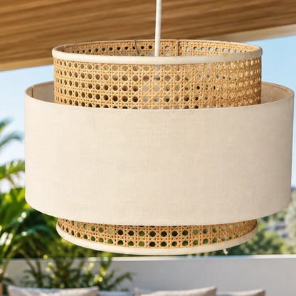 Close-up of layered cane weave and off-white fabric shade