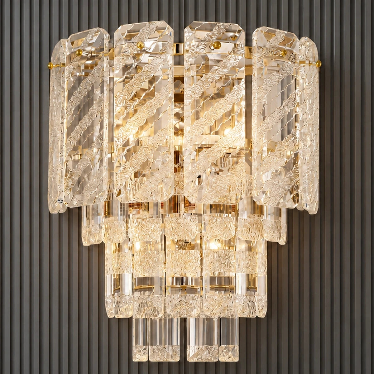 Layered crystal and gold wall light illuminated