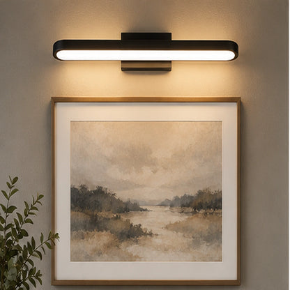 Rounded LED mirror light above artwork