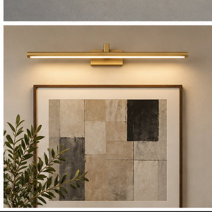 Gold slim linear picture light above framed artwork