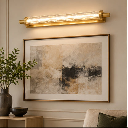 Gold faceted glass linear picture light above framed artwork