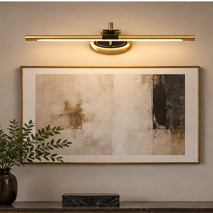 Semicircle linear wall light above artwork