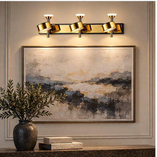 Illustrative scene: gold three-head wall light above artwork