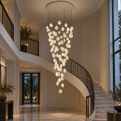 Cascading white petal double-height chandelier in an entrance atrium