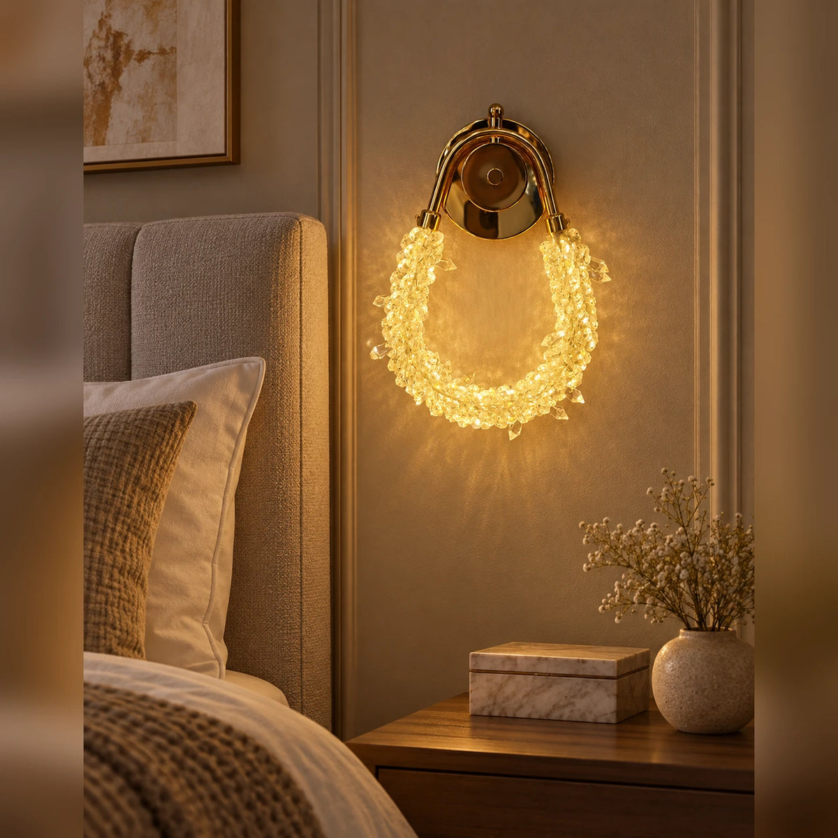 Faceted loop decorative wall light beside a bed