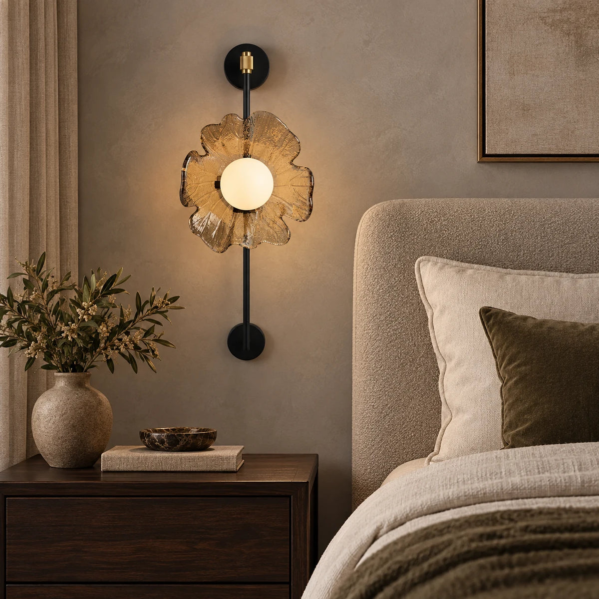 Textured petal globe wall sconce beside a bed