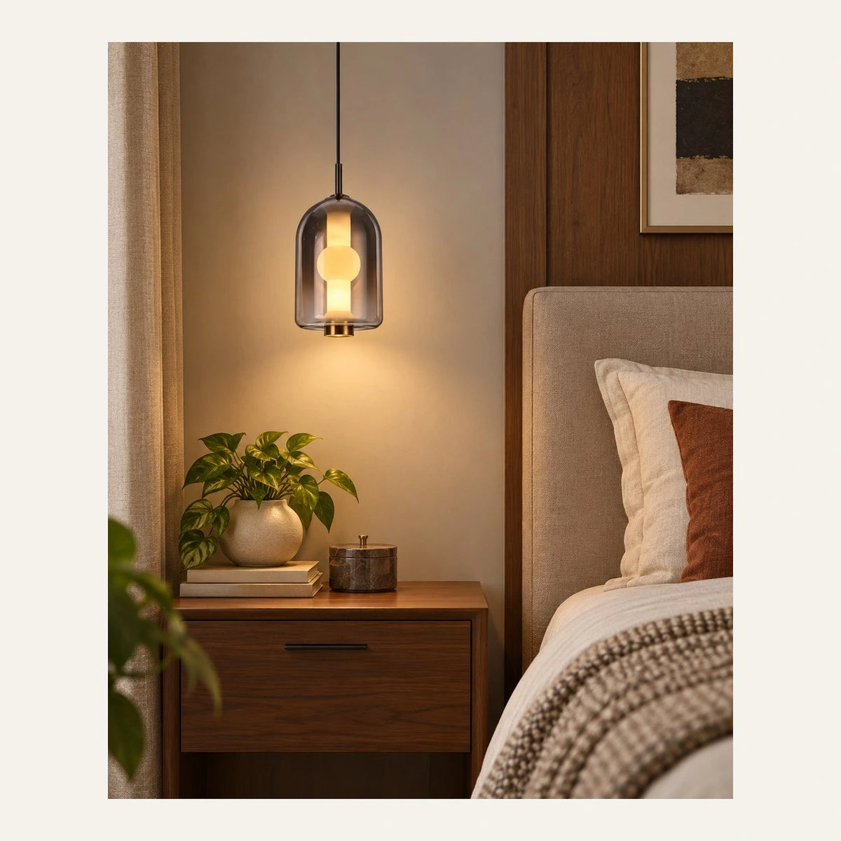 Smoke capsule glass pendant beside a bedroom nightstand
