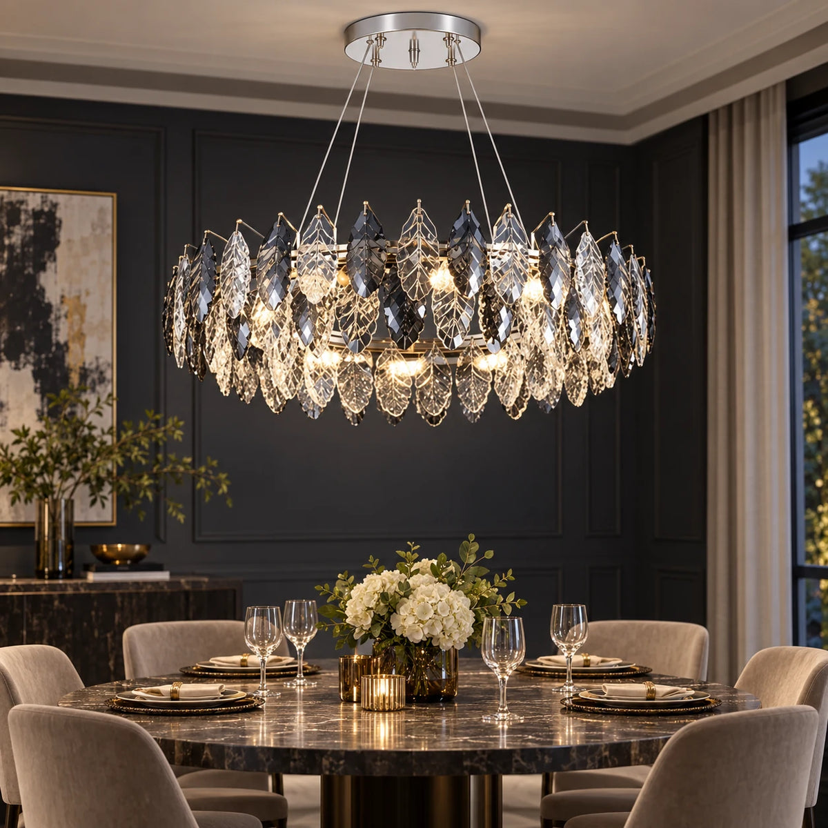 Oval crystal leaf chandelier above a dining table