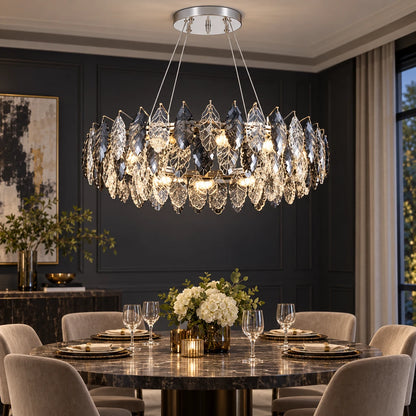 Oval crystal leaf chandelier above a dining table