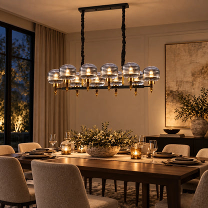 Smoke-glass ten-light linear pendant above a dining table