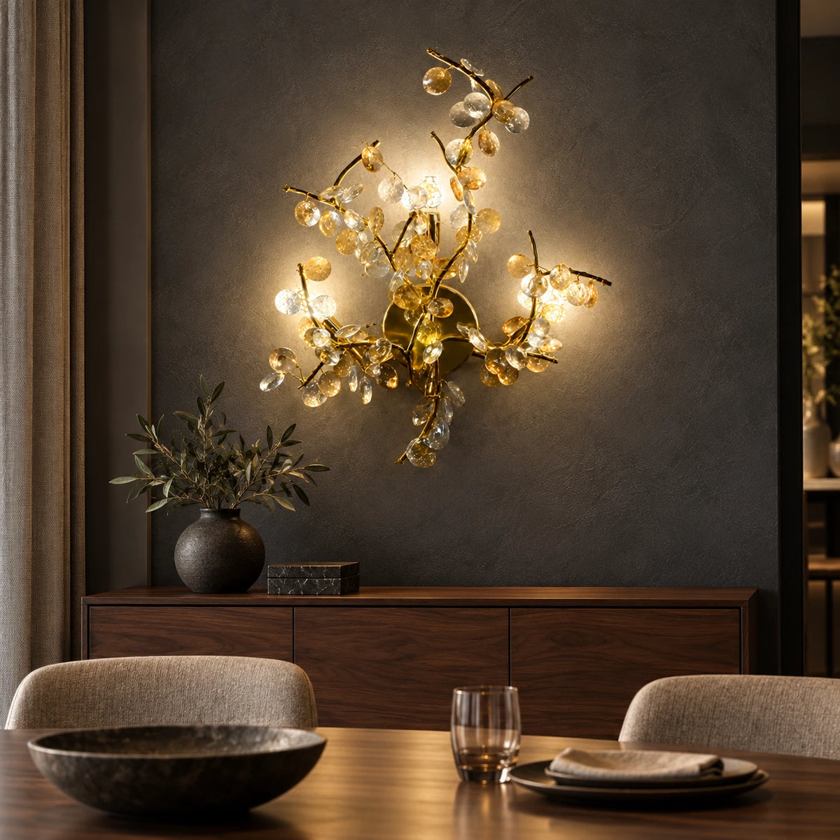 Illuminated floral-branch wall sculpture above a dining-room sideboard