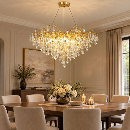 Gold branch crystal chandelier above a dining table