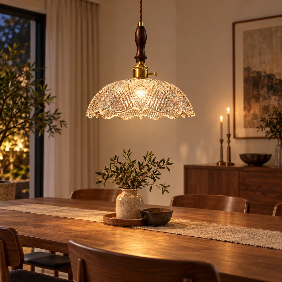 Diamond-cut glass dome pendant above a dining table