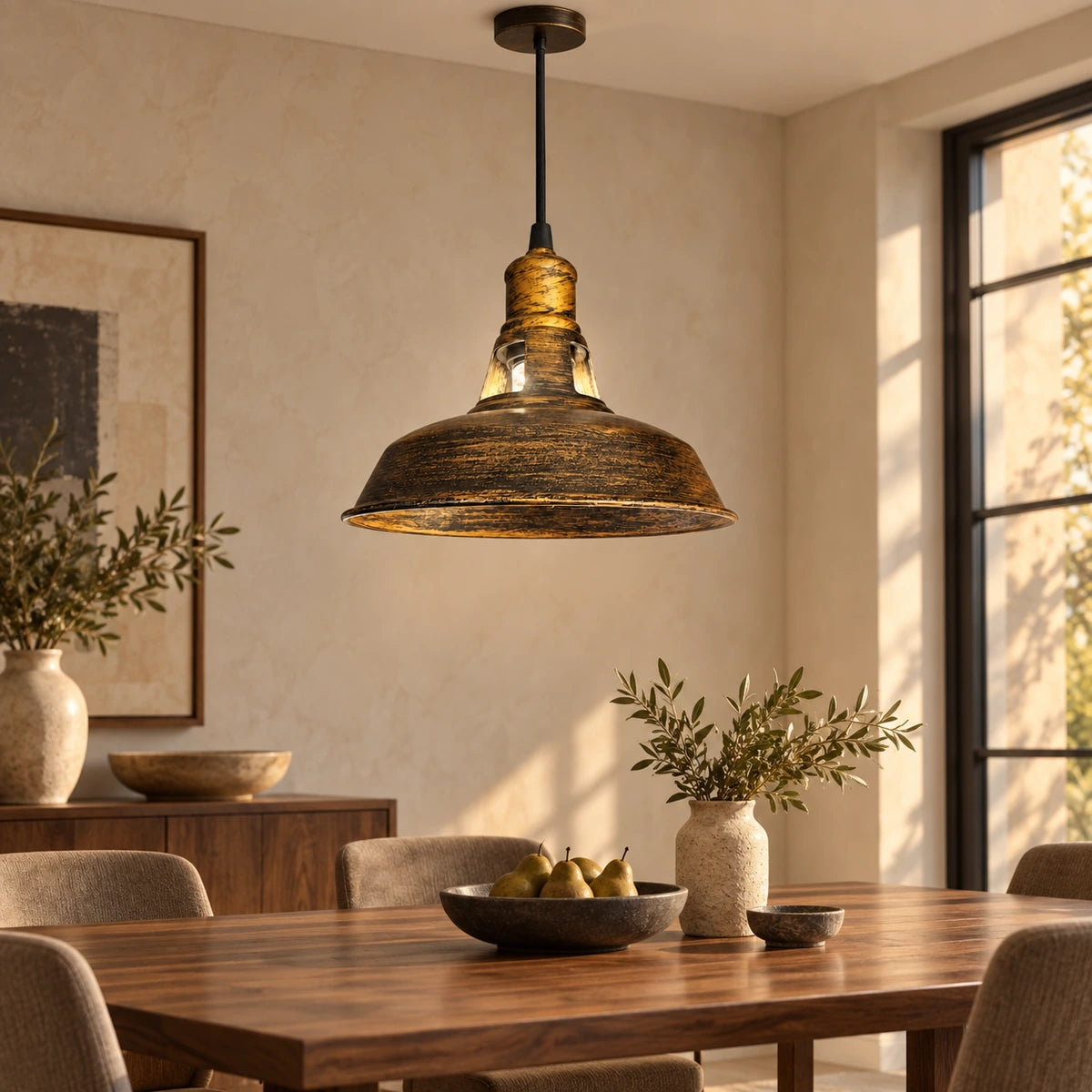 Antique-gold dome pendant above a dining table