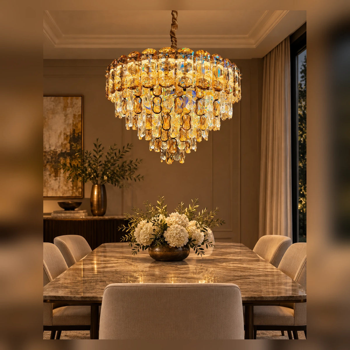 Tiered faceted drop chandelier above a dining table