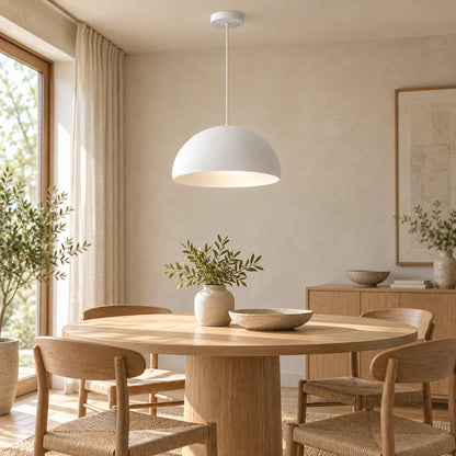 White soft dome pendant above a round dining table