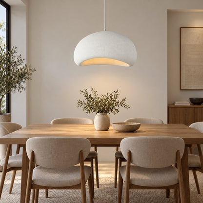 White textured curved dome pendant above a contemporary dining table