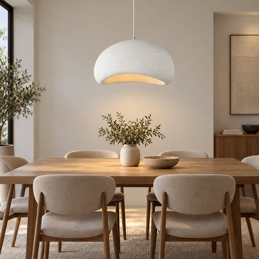 White textured curved dome pendant above a contemporary dining table