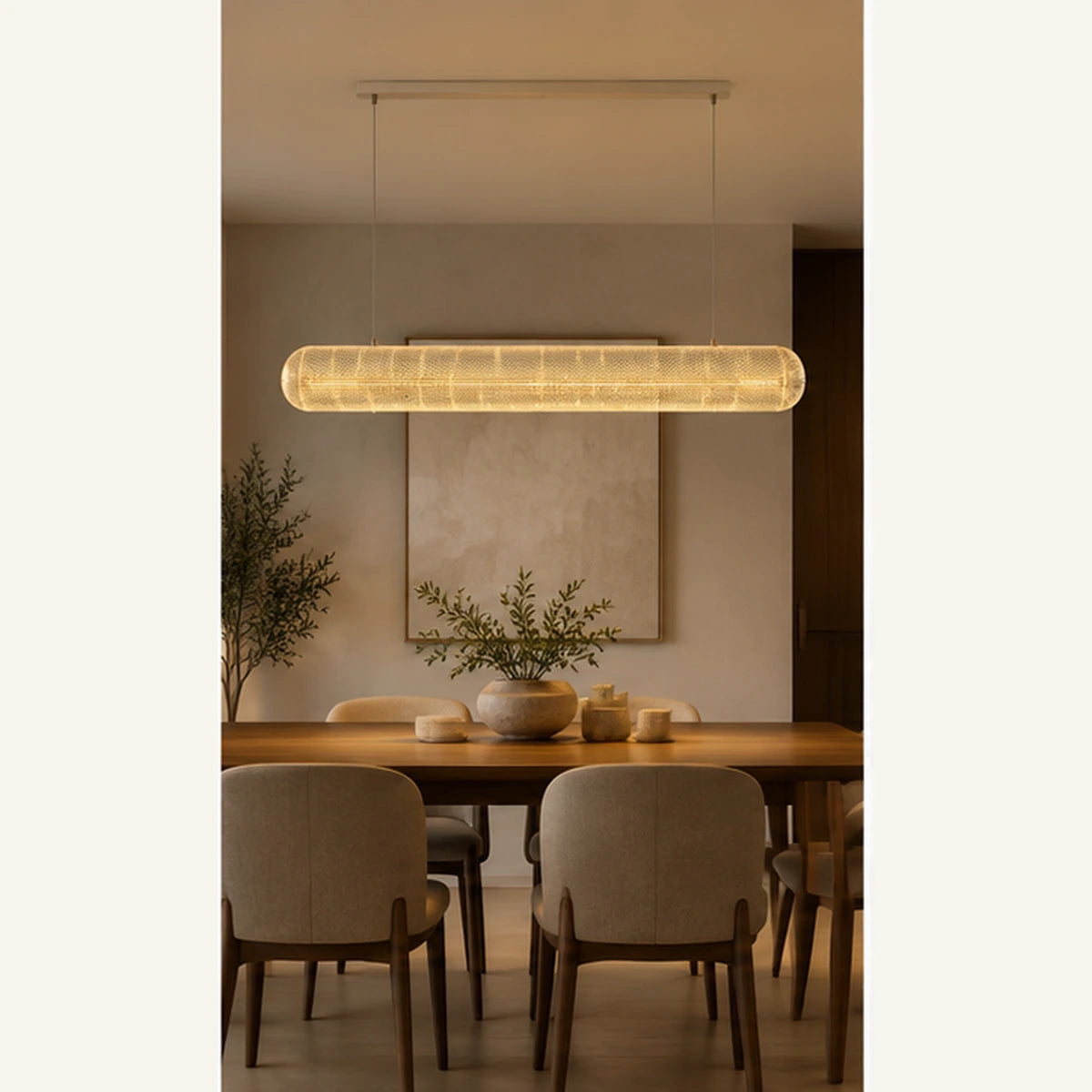 Clear acrylic linear pendant above a dining table