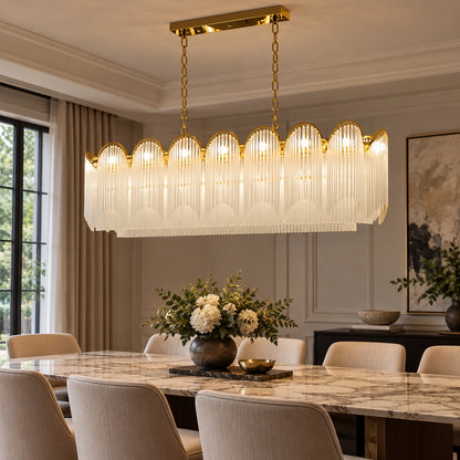 Scalloped frosted-glass chandelier above a dining table