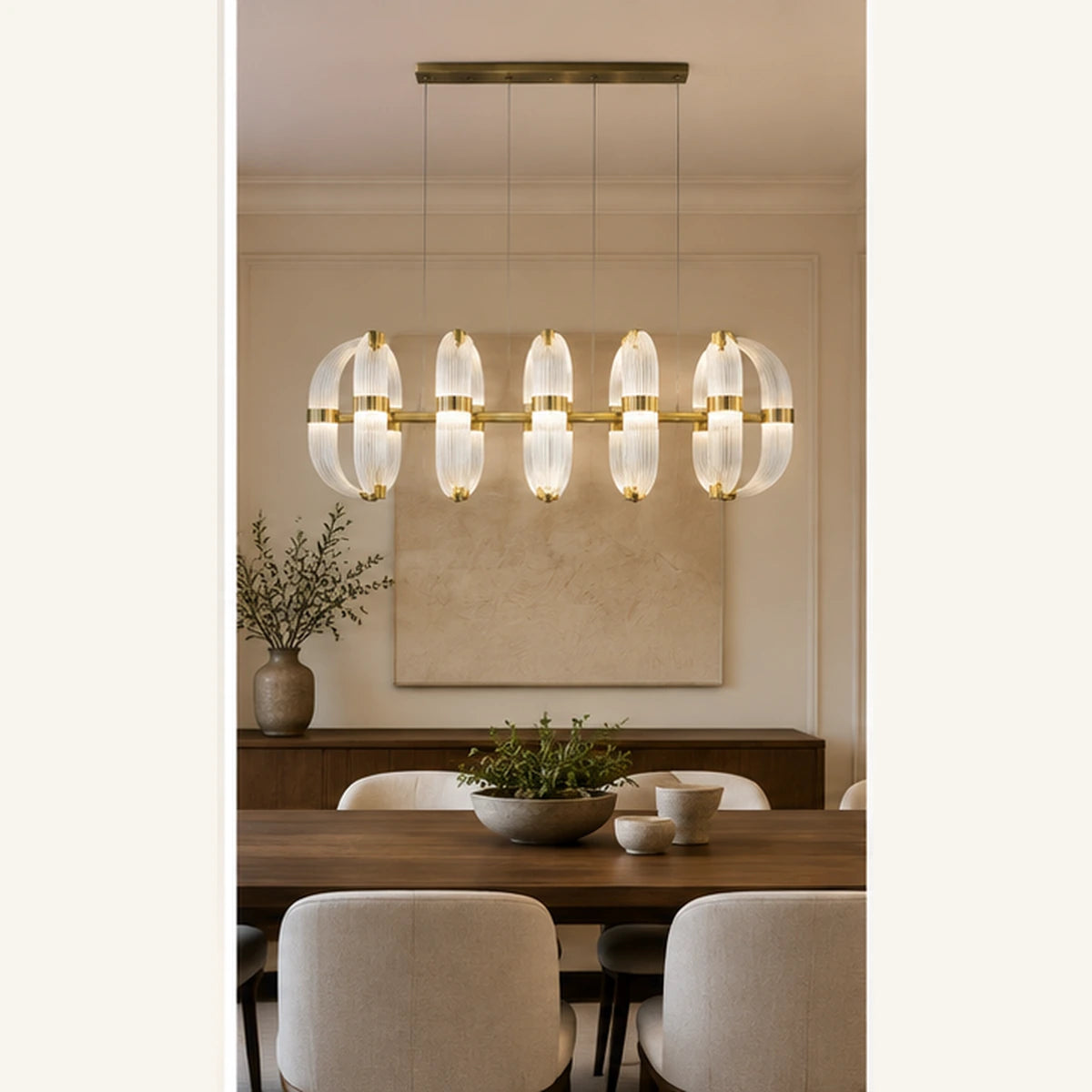 Ribbed glass linear chandelier above a dining table