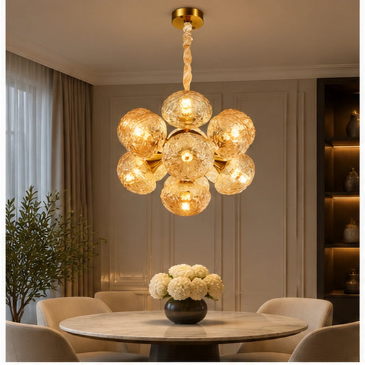 Amber globe cluster chandelier above a dining table