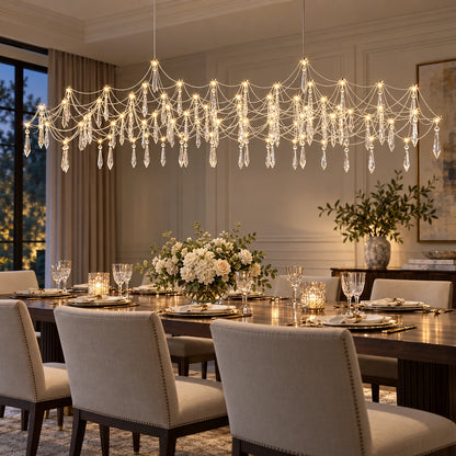 Chrome crystal draped chandelier above a dining table
