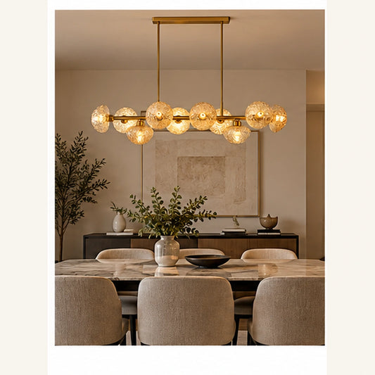 Gold amber globe chandelier above a dining table