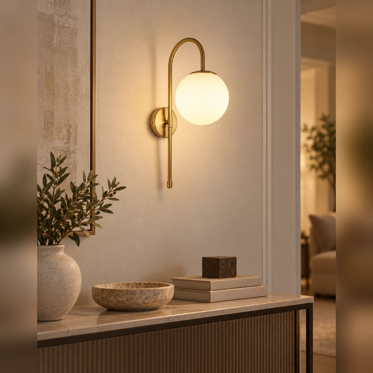 Arched globe wall light above an entrance console