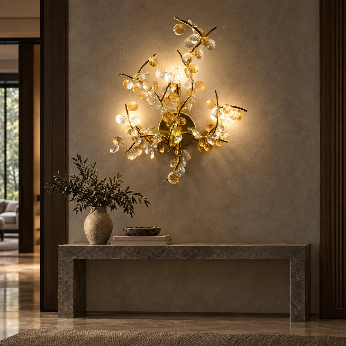 Illuminated floral-branch wall sculpture in an entrance foyer