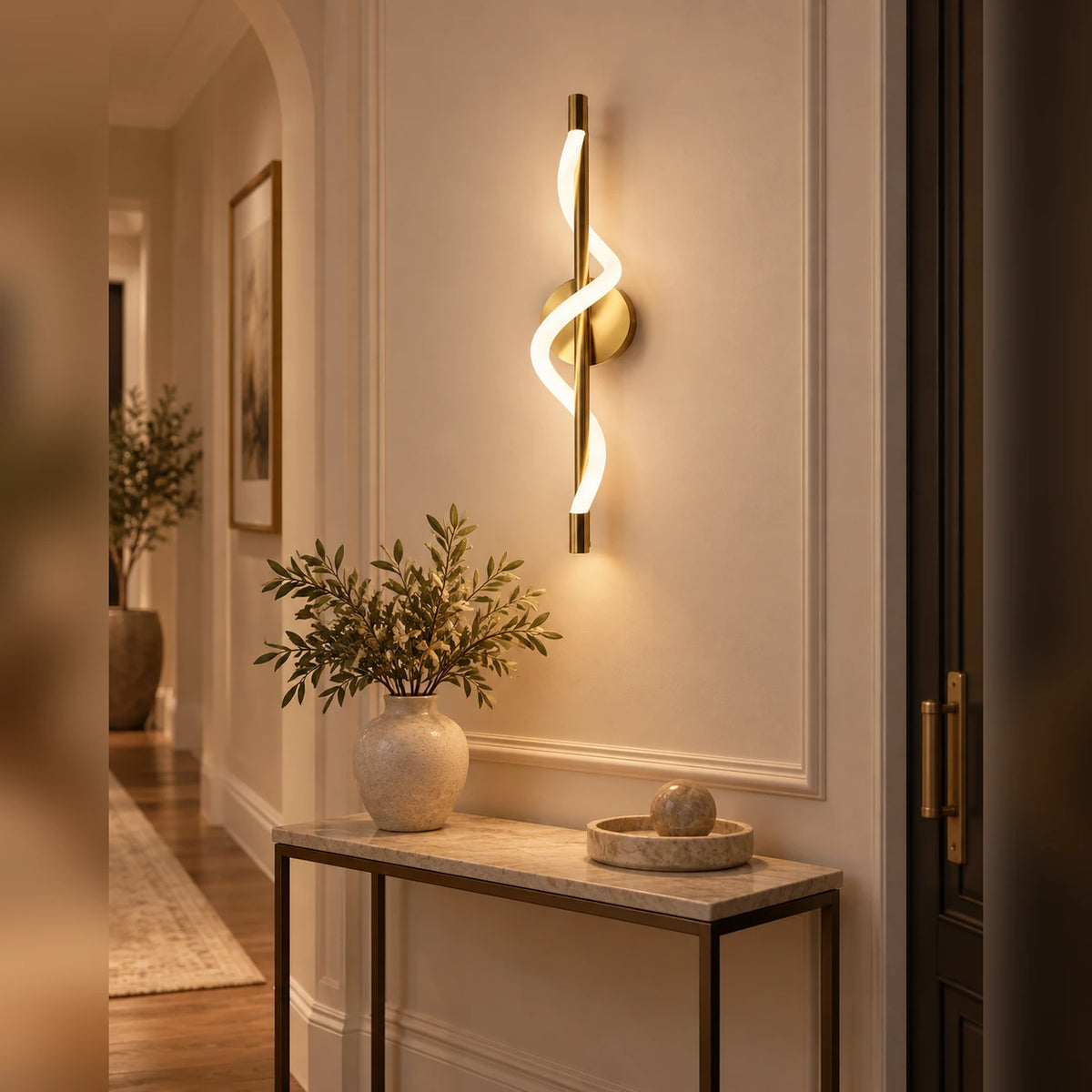 Twisted ribbon linear wall light in an entryway
