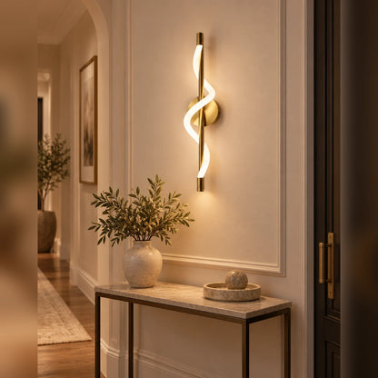 Twisted ribbon linear wall light in an entryway