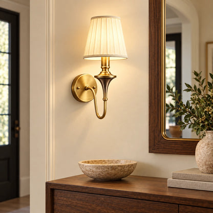 Tapered shade wall sconce in a warm entryway