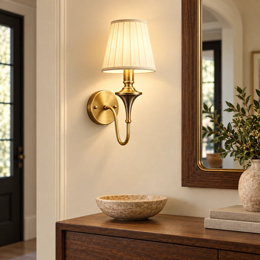 Tapered shade wall sconce in a warm entryway
