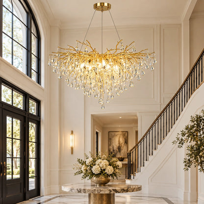 Gold branch crystal chandelier in a double-height foyer
