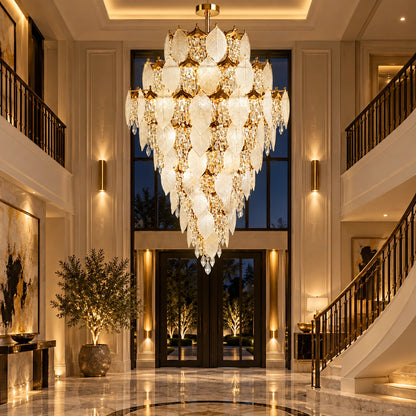 Grand frosted leaf chandelier in a double-height foyer