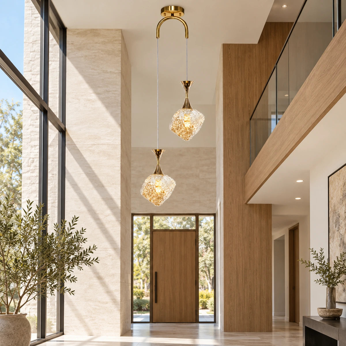 Textured-glass two-light pendant in a double-height foyer