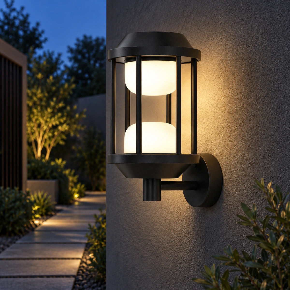 Twin-glow cage wall light along a sheltered garden walkway