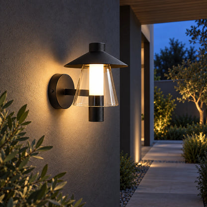 Hooded wall light along a sheltered garden walkway