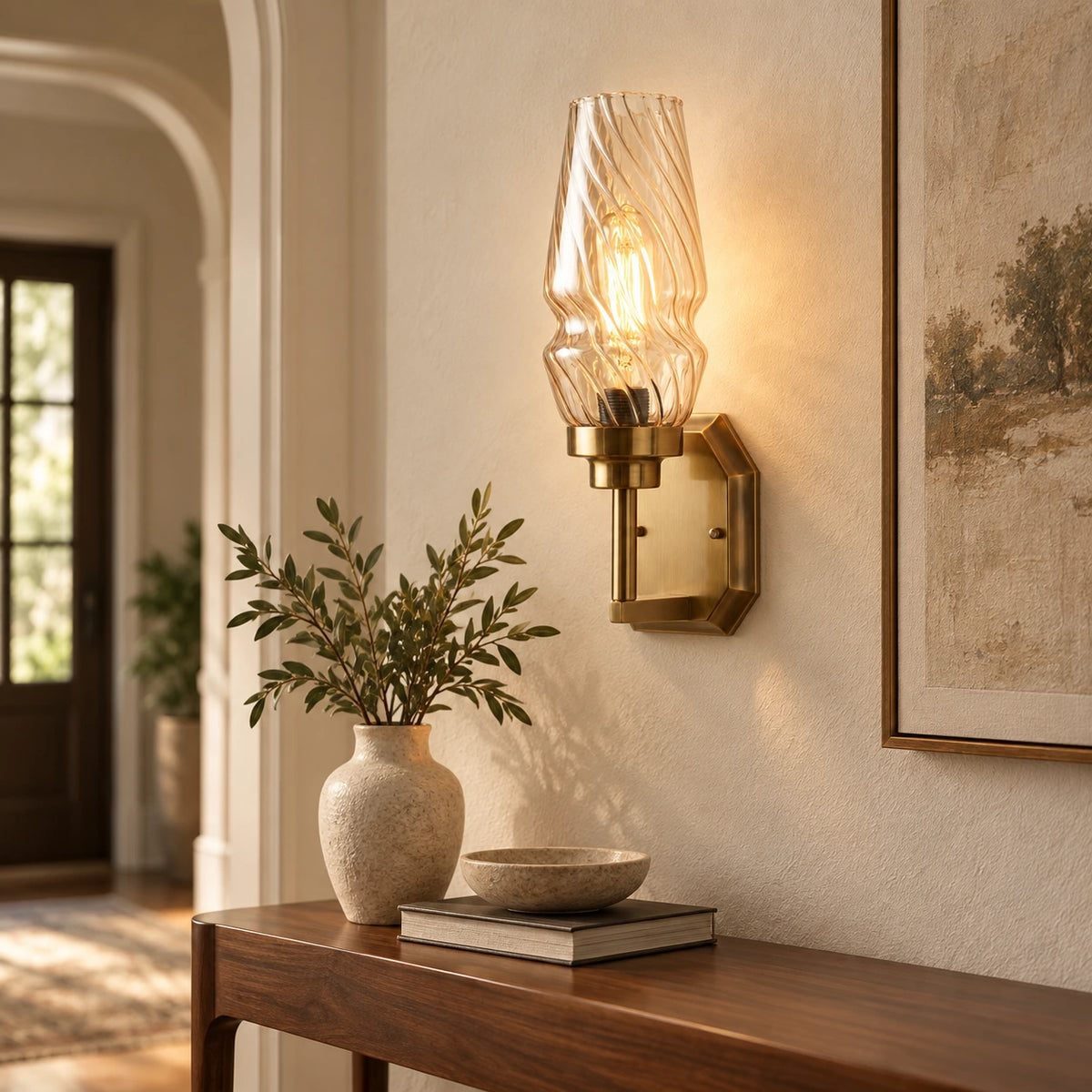 Sculpted ripple-shade wall sconce above a hallway console