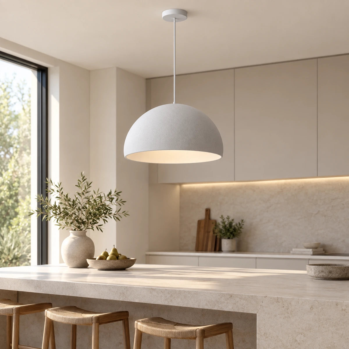 Grey soft dome pendant above a kitchen island