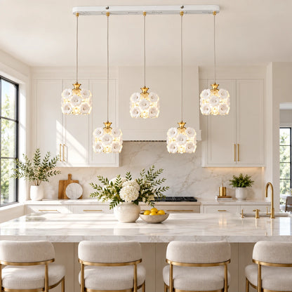 Floral ceramic five-shade pendant cluster above a kitchen island