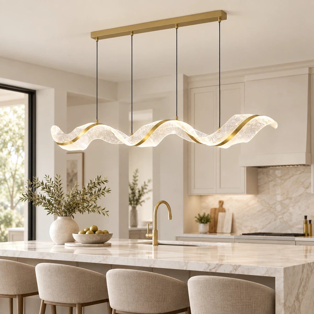 Sculptural wave LED chandelier above a kitchen island