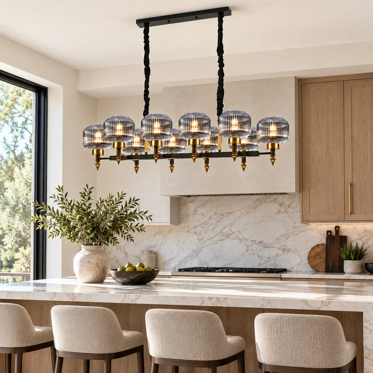 Smoke-glass ten-light linear pendant above a kitchen island