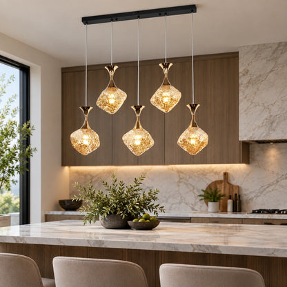 Five-light faceted glass cluster pendant above a kitchen island