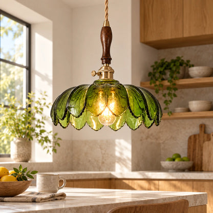 Green petal glass pendant above a bright kitchen counter