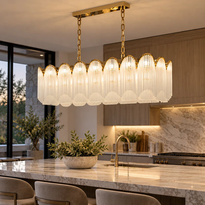 Scalloped frosted-glass chandelier above a kitchen island