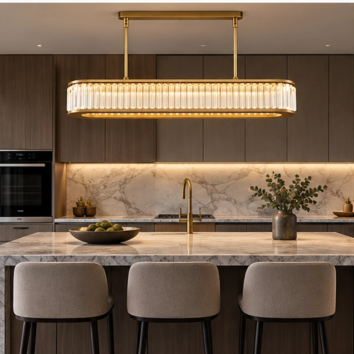 Linear crystal chandelier above a kitchen island